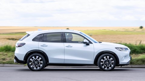 Honda ZR-V (2023) review: pan shot driving, country lane, white