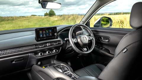 Honda ZR-V (2023) review: dashboard and interior from passenger side, black leather upholstery