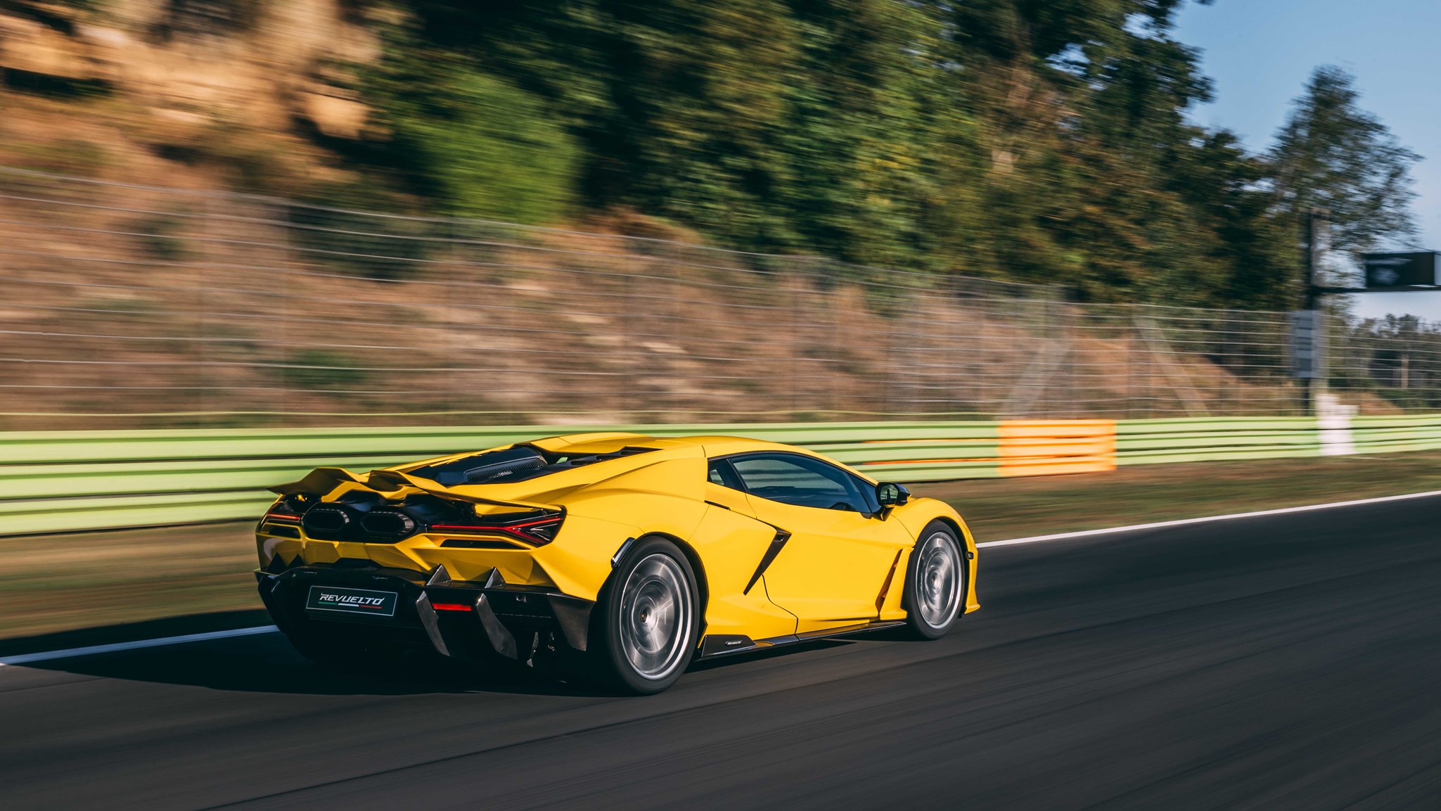 Lamborghini Revuelto rear three-quarter driving