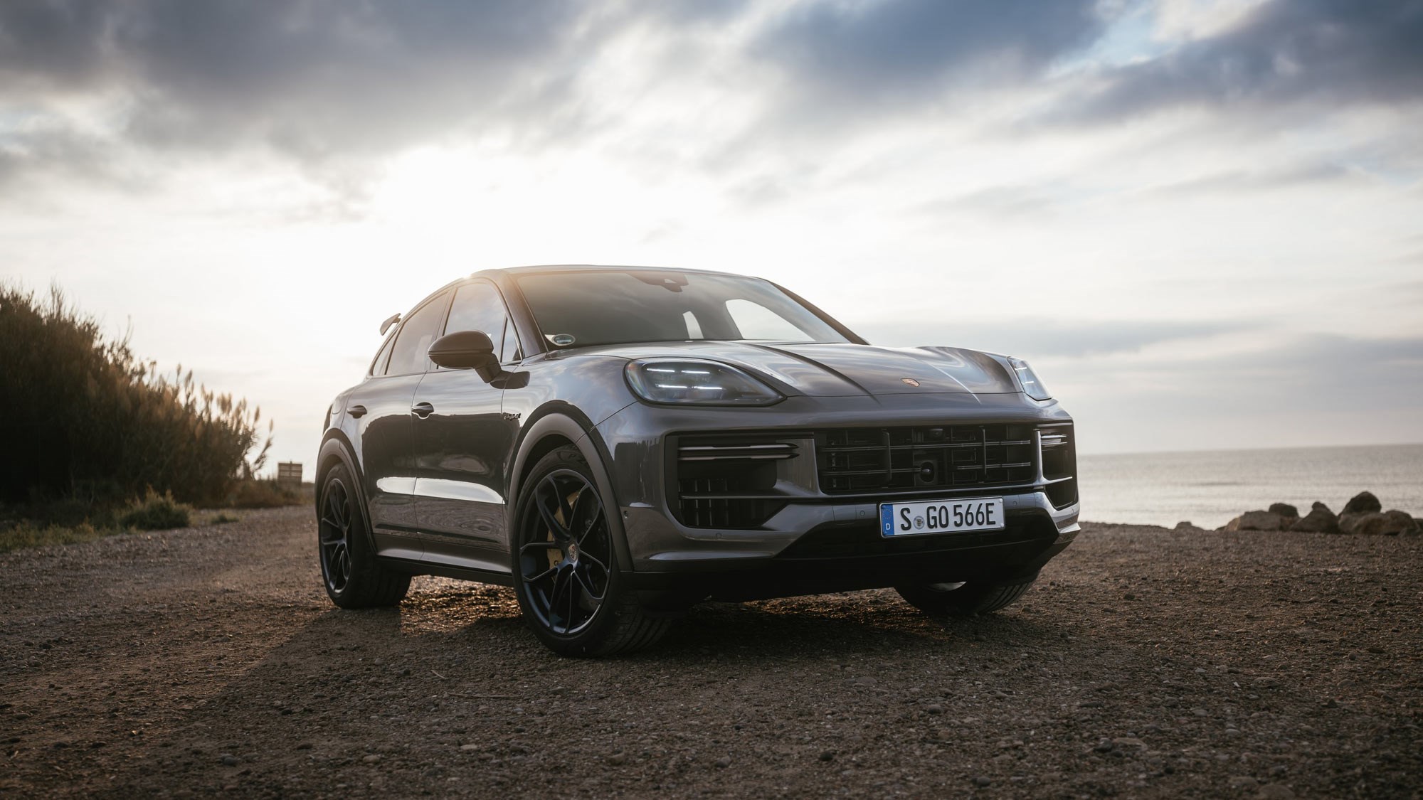 Porsche Cayenne Coupe review - 2023 facelift - Turbo E-Hybrid with GT Package, front, grey, dramatic sky