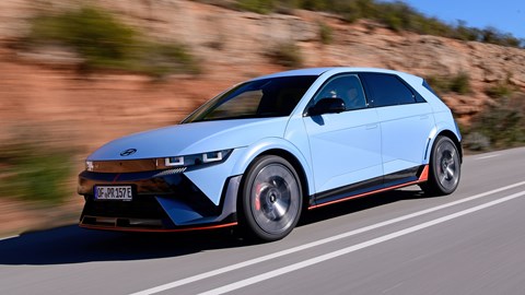 Hyundai Ioniq 5 N (2024) review: front three quarter driving, low angle, blue paint, Spanish roads