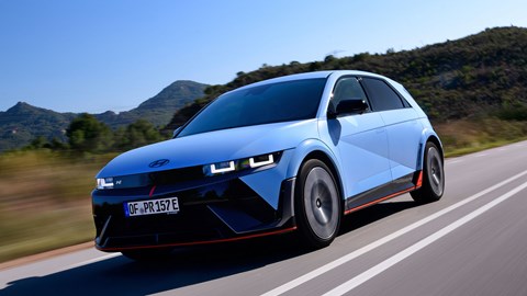 Hyundai Ioniq 5 N (2024) review: front three quarter tracking, blue paint, Spanish roads