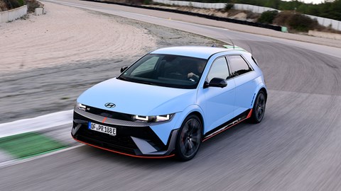 Hyundai Ioniq 5 N (2024) review: front three quarter cornering, high angle, blue paint, on track