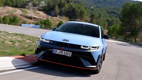 Hyundai Ioniq 5 N (2024) review: rear three quarter driving, blue paint, on track