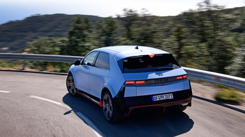 Hyundai Ioniq 5 N (2024) review: rear three quarter driving, blue paint, Spanish mountain roads