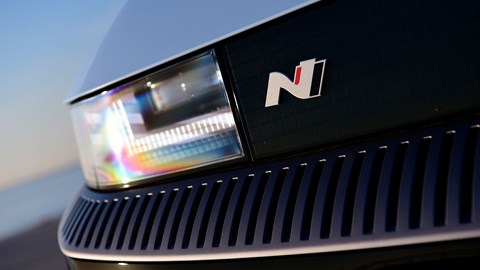 Hyundai Ioniq 5 N (2024) review: LED headlight and radiator grille detail, blue paint