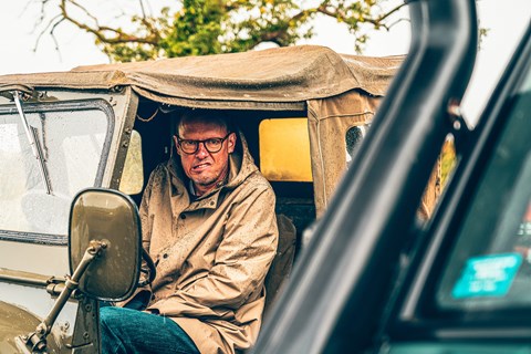 Mark Walton shivers in an old Jeep, photographed for CAR magazine by Jordan Butters