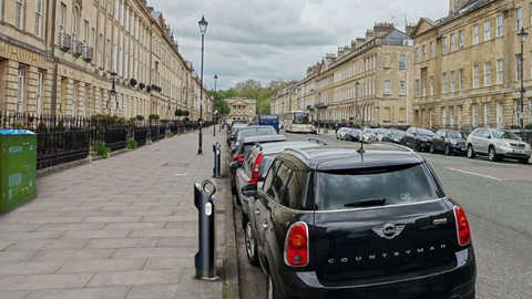 Electric Mini on charge at the side of the road