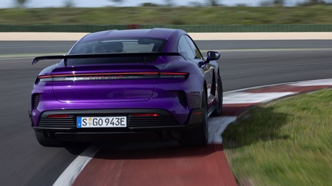 Porsche Taycan Turbo GT review - Purple Sky Metallic, Weissach package, rear view, driving round corner on track
