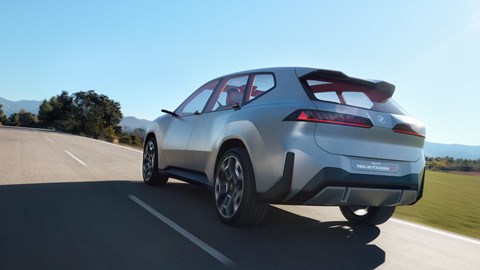 BMW Neue Klasse X electric SUV concept, rear view 'driving' on road, low