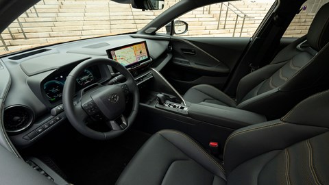 Toyota C-HR PHEV (2024) review: dashboard and infotainment system, black upholstery