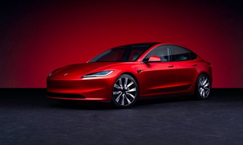 Tesla Model 3 facelift: front three quarter view, red paint, studio shoot