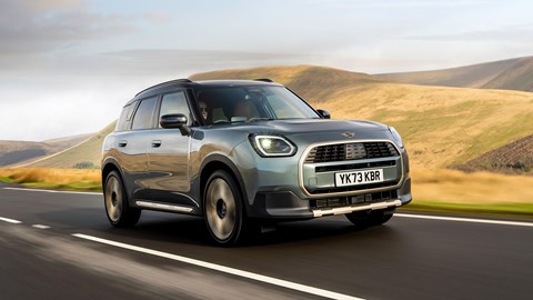 MINI Countryman (2024) review: front three-quarter driving, British B-road, silver and gold paint