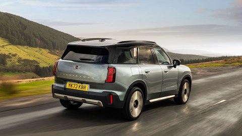 MINI Countryman (2024) review: rear three-quarter driving, British B-road, silver and gold paint