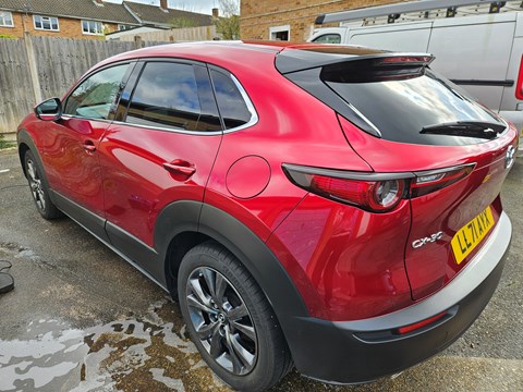 A shiny red car after being cleaned 