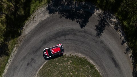 Image of the Lancia Ypsilon Rally2 HF Integrale, viewed from the top, going round a left-hand corner