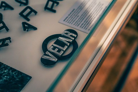 Velar badge was crafted in old-fashioned script to put snooping spies off the scent