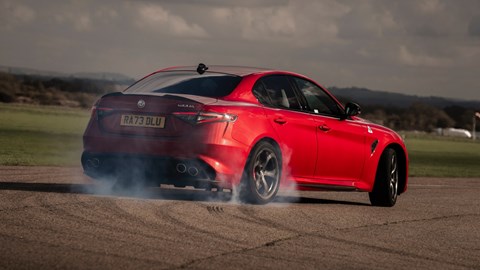 Election manifestos 2024: a red Alfa Romeo Giulia QV doing a skid on a race track, (representing the Labour party)