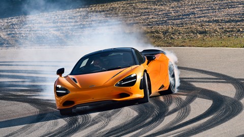 Election manifestos 2024: a yellow McLaren 750S doing a skid on a race track, (representing the Liberal Democrat party)