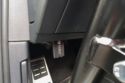 The Carly OBD II scanner installed in a car