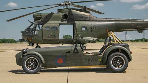 Caterham Seven 360R built with parts from RAF Puma HC2 helicopter - side, close, with helicopter