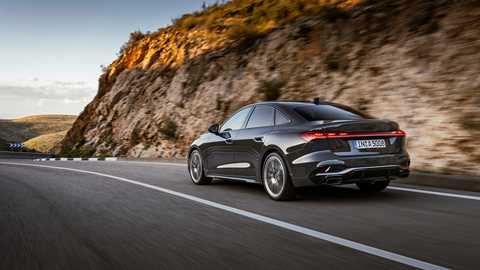 Audi A5: rear three quarter driving, grey paint