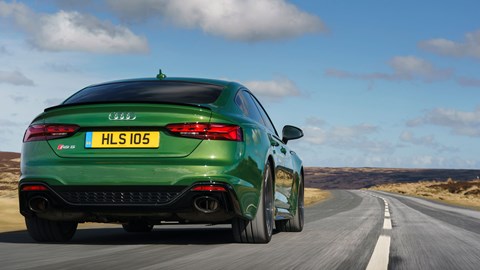 Audi RS5 Sportback: rear three quarter driving, low angle, green paint