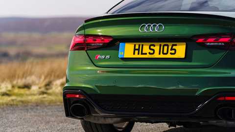 Audi RS5 Sportback: rear badge detail shot, low angle, green paint