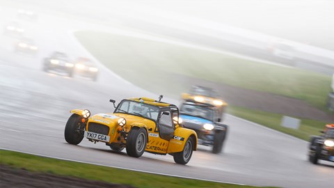 Close racing at Rockingham in the wet during the Caterham Academy