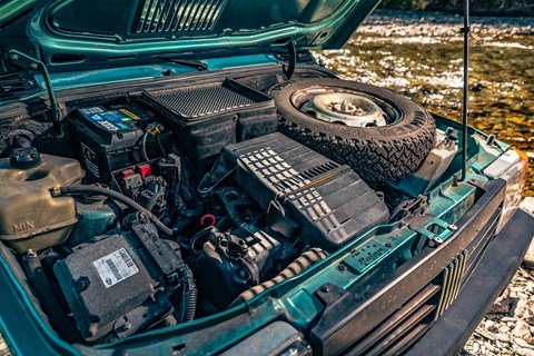 Engine bay harks back to simpler times... note spare wheel