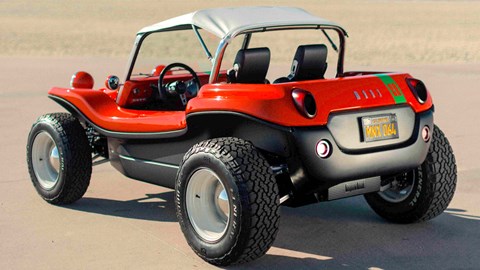 Meyers Manx 2.0 EV - rear, red with white Bimini roof and green stripe, on beach