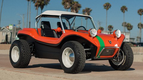 Meyers Manx 2.0 EV - electric dune buggy, Old Red livery, on beach with palm trees