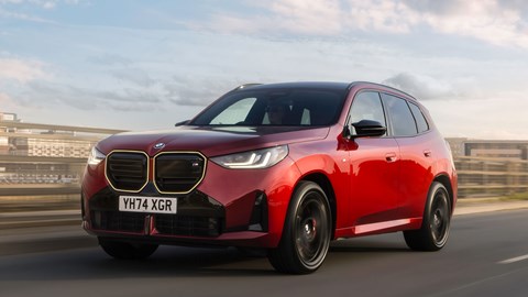 BMW X3 (2024) review: front three quarter driving, low angle, red paint