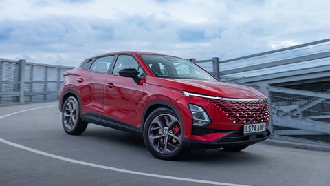 Omoda 5 review, front, red, driving round corner