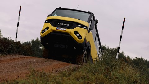 Torsus Praetorian review - front, yellow, cresting a slope