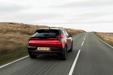 Alfa Romeo Giulia Junior, rear three quarter driving, red paint