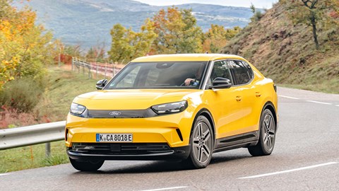 Ford Capri (2024) review: front three quarter cornering, yellow paint, low angle