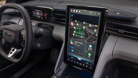 Ford Capri (2024) review: infotainment system, in upright position, showing hidden storage bin