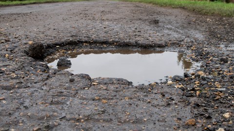 Pothole in road - UK Budget 2024