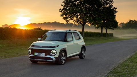 Hyundai Inster on the road in the evening