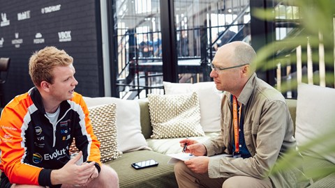 Image of writer Graham King in conversation with Porsche Carrera Cup GB driver Josh Stanton