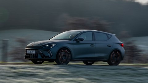 Cupra Leon (2024) review: side view driving, matte grey paint