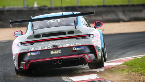 Image of Abbie Eaton in her Porsche 911 race car, exiting corner at Croft