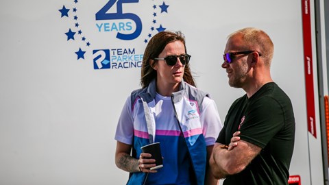 Image of Abbie Eaton in conversation with team member at Croft