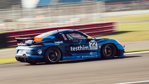 Image of Toby Trice in his Porsche Cayman race car on track at Silverstone