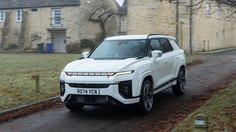 KGM Actyon (2025) review: front three quarter driving, white paint, through a village