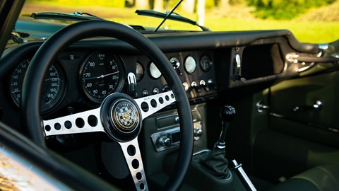 Jaguar E-Type by E-Type UK (2025) review: steering wheel and dashboard, green leather upholstery