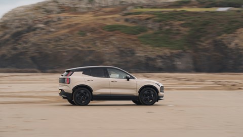 Curtis driving the Volvo EX30 CC on the beach