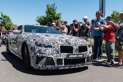 BMW’s M Division gave the world a preview of its upcoming M8 luxury performance car, as a camouflaged prototype completed a demo lap of the circuit before the start of the 24h race