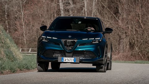 Alfa Romeo Junior Ibrida (2025) review: front three quarter cornering, blue paint